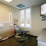Patient room with dental chair and equipment